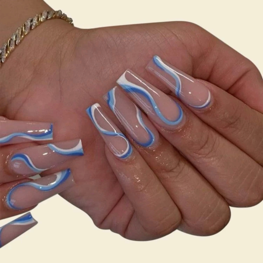false press on nails that are a nude colour with light blue and white swirl designs throughout