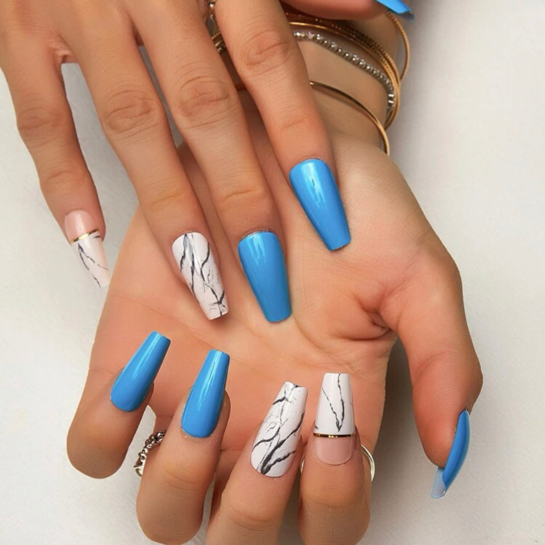 short blue coffin shaped press on nails with white marble accents with touches of gold foil