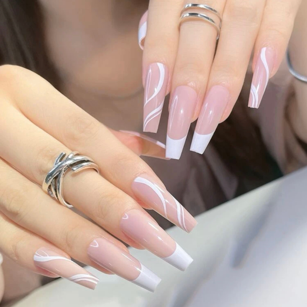 long coffin press on nails with an elegant french tip design and abstract white lines on the accent nails