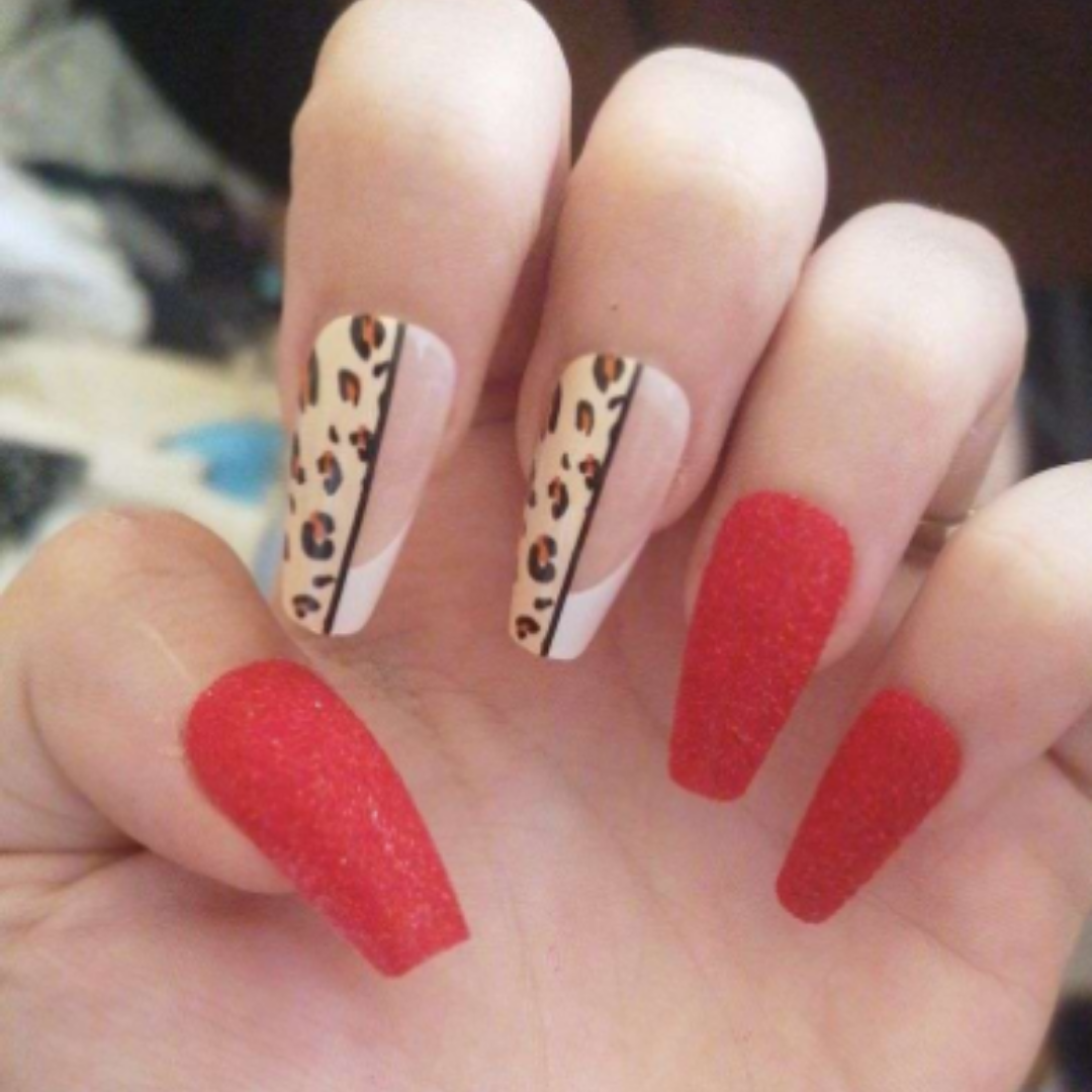 short coffin shaped press on nails with a leopard print design and red sugar accent nails